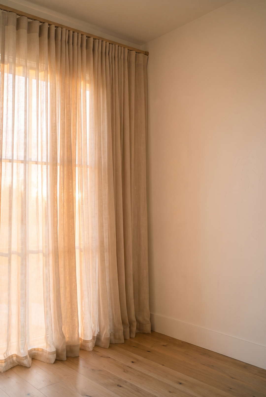 Sheer linen curtains glowing in soft daylight