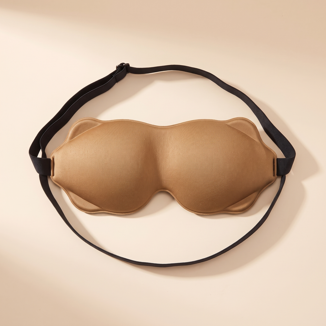3D Contoured Sleep Mask in Caramel – overhead view with strap looped around the mask