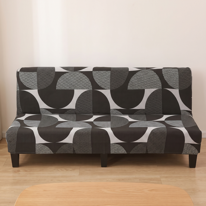 Stretch Futon Cover – Armless in Black – Half Circle – centered front view with blurred wooden tabletop in foreground