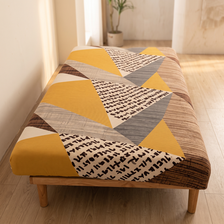 Stretch Futon Cover – Armless in Brown – Patchwork – foot end view of triangle panels on low wooden frame