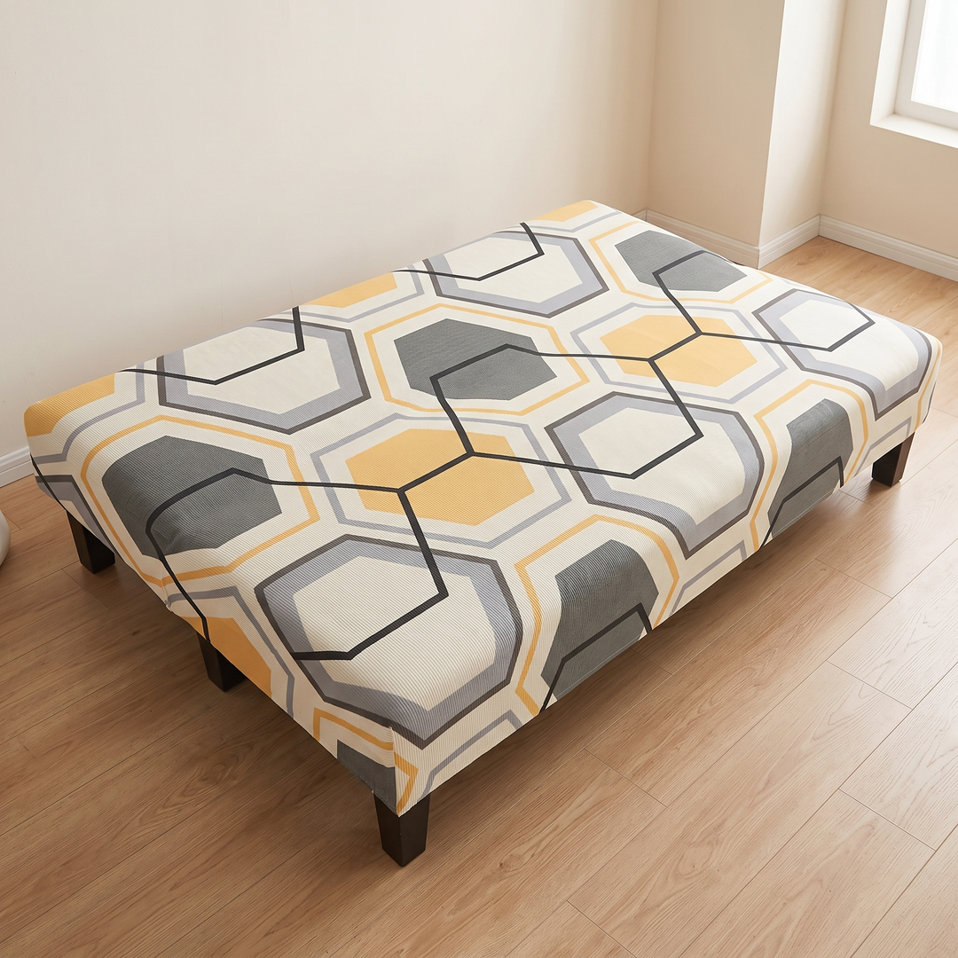 Stretch Futon Cover – Armless in Cream – Hexagon – high angle view of the full top surface in an empty room