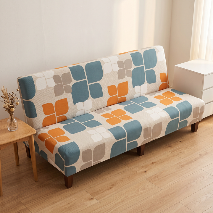Stretch Futon Cover – Armless in Dusty Teal – Retro Flower – between a wooden side table and white chest of drawers