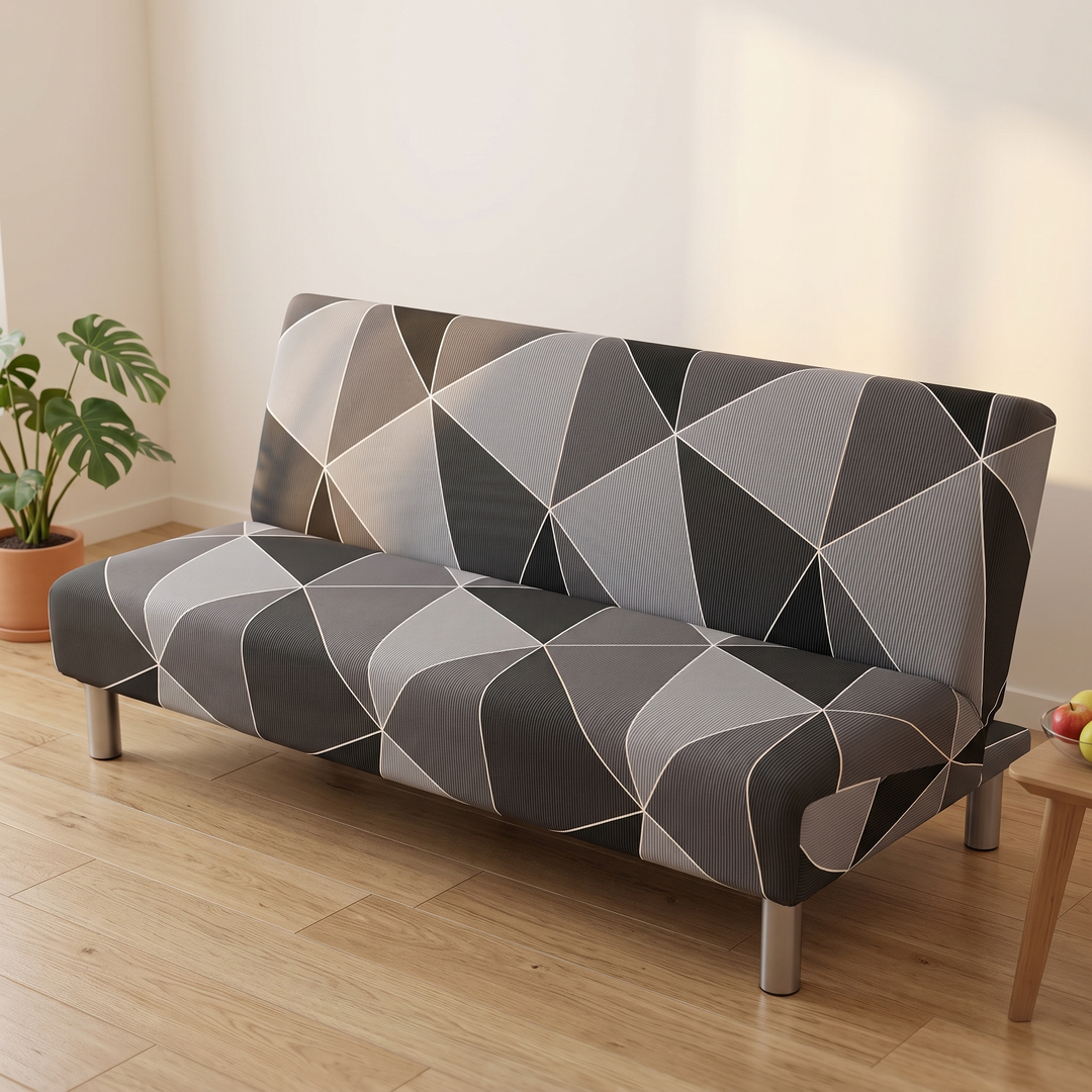 Stretch Futon Cover – Armless in Gray – Geometric – with a bowl of fruit on a wooden table nearby