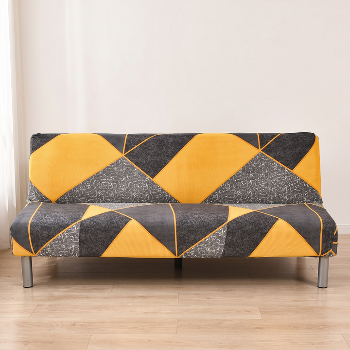 Stretch Futon Cover – Armless in Mustard – Triangle – level front view with metal legs on bare plank floor