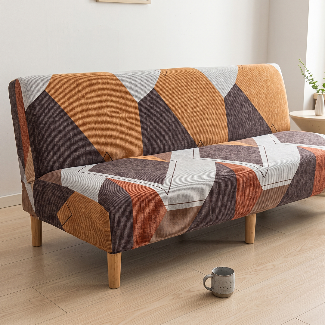 Stretch Futon Cover – Armless in Rust – Geometric – angled view with speckled mug on floor in foreground