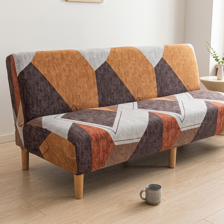 Stretch Futon Cover – Armless in Rust – Geometric – angled view with speckled mug on floor in foreground