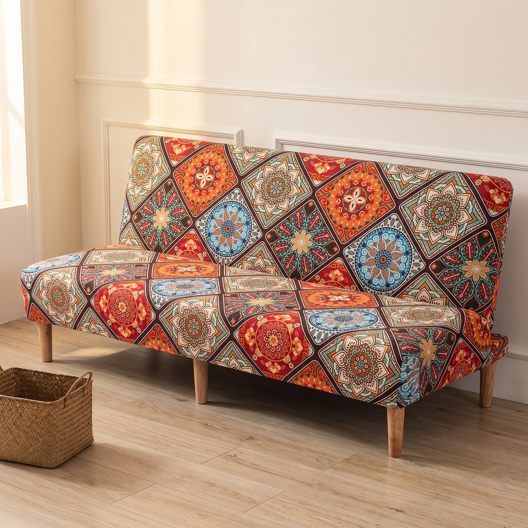 Stretch Futon Cover – Armless in Rust – Mandala Tile – angled from the left against a white wall with paneled molding