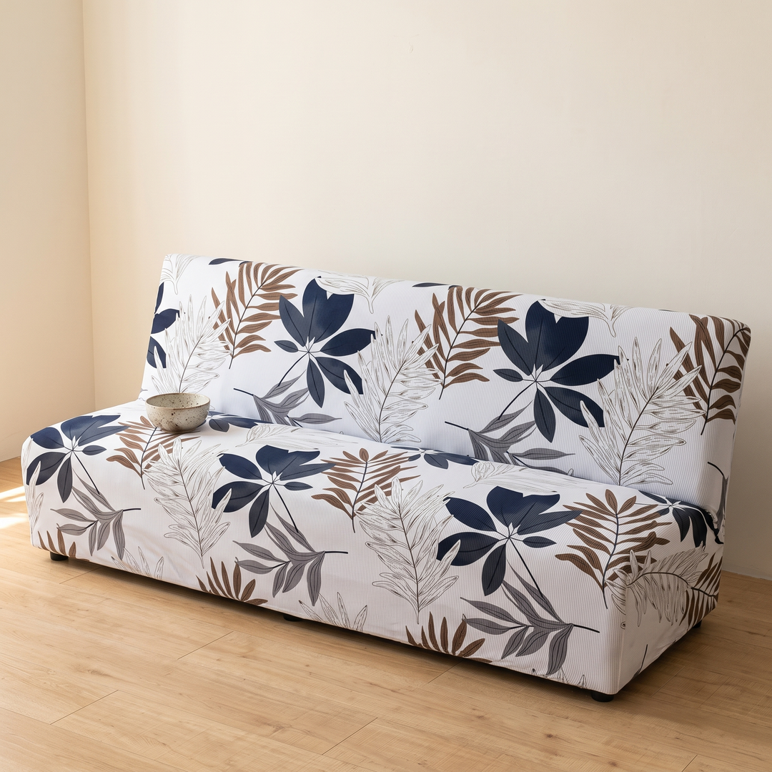 Stretch Futon Cover – Armless in White – Leaf Print – with a small ceramic bowl resting on the seat