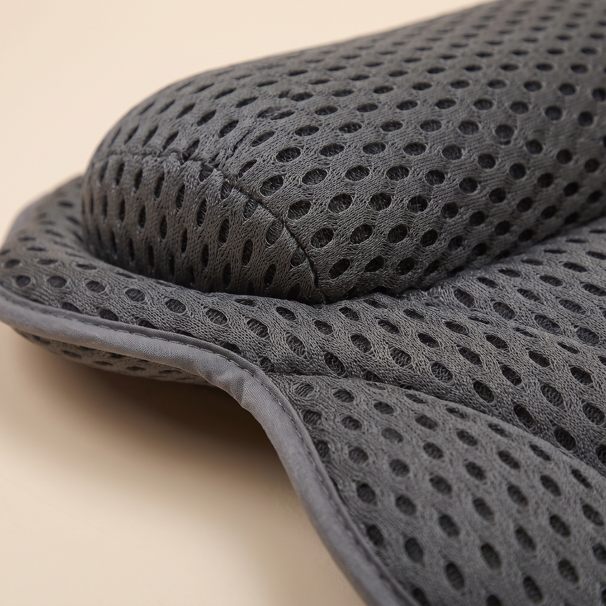 Bath Pillow with Suction Cups in Dark Gray – close-up of the perforated mesh fabric and stitched edge