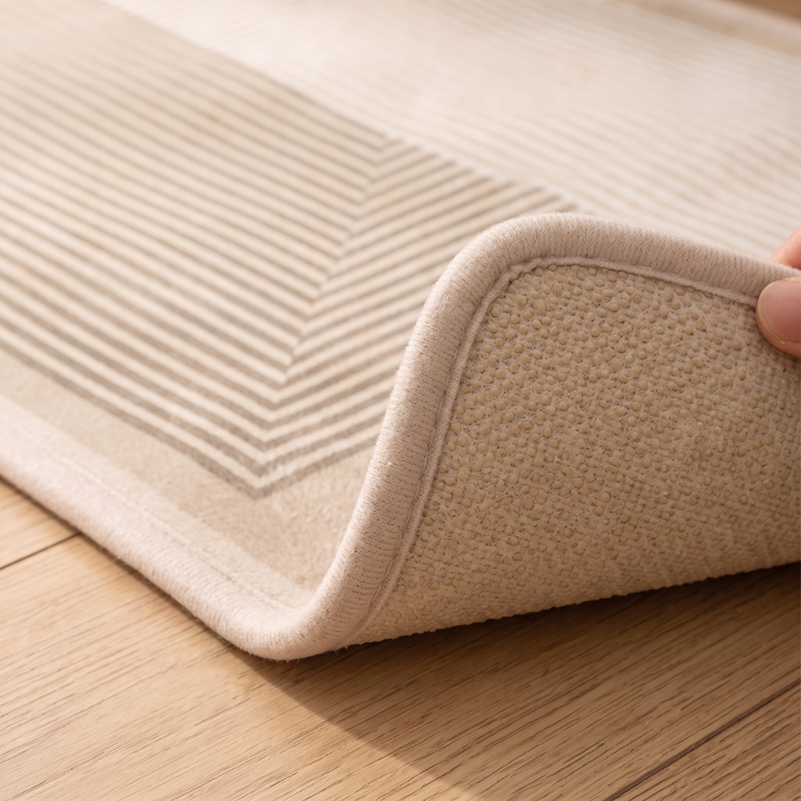 Bedroom Runner Rug in Beige – Striped – corner lifted by hand to show woven backing and bound edge