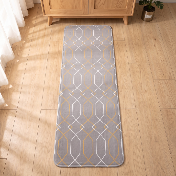 Bedroom Runner Rug in Gray – Trellis – on wood floor in front of wooden cabinet and plant