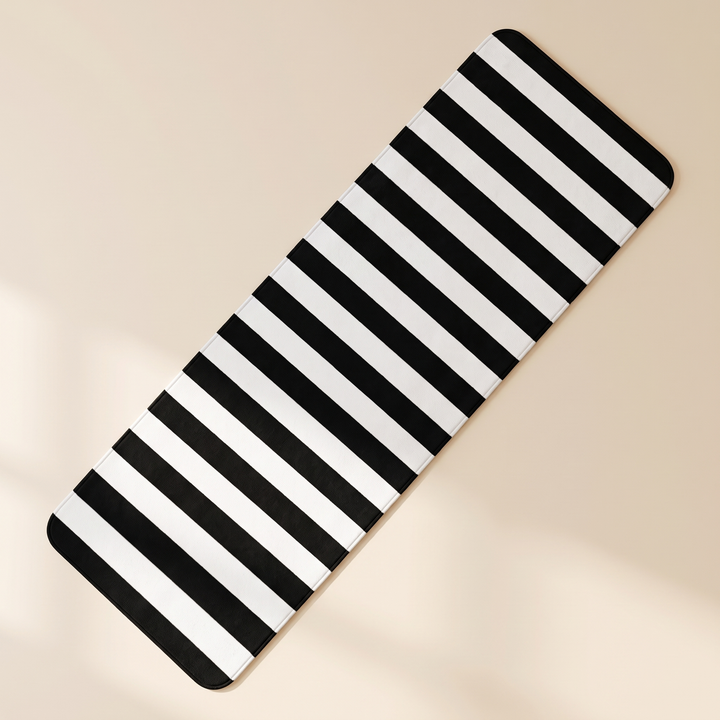 Black and White Runner Rug – Washable in Black &amp; White – Crosswise Stripe – flat overhead view on a plain cream surface with soft shadows