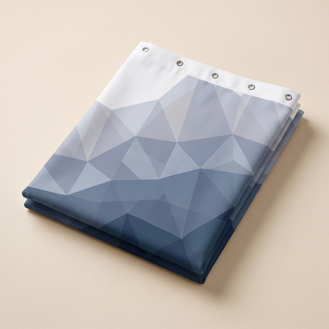 Blue Geometric Fabric Shower Curtain in Blue – folded neatly on a plain beige surface showing grommets along the top edge
