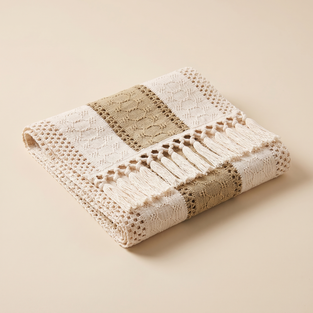 Boho Table Runner with Tassels in Khaki – folded neatly on a plain beige background, tassels along front edge