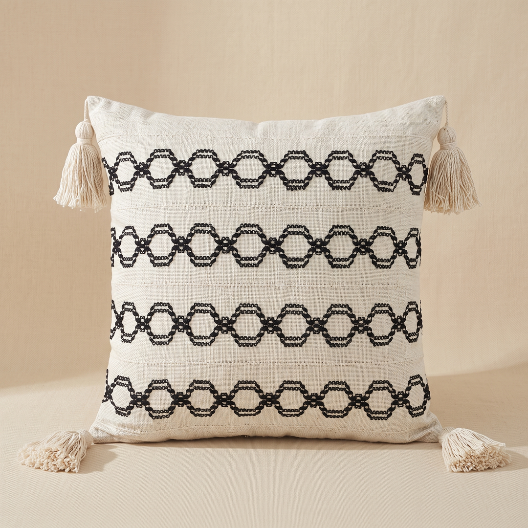 Boho Pillow Cover with Tassels – Woven in Cream – Black Chain – four evenly spaced rows of linked hexagon embroidery across the front