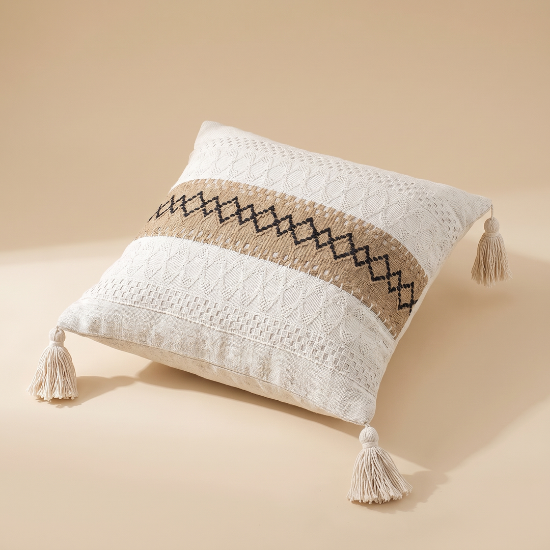 Boho Pillow Cover with Tassels – Woven in Tan – Black Diamond Band – lying diagonally with one corner pointing toward the camera