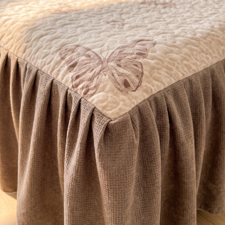 Butterfly Quilt with Ruffled Edge in Beige Butterfly – close-up of the gathered ruffle at a bed corner