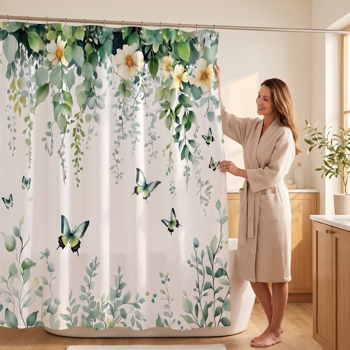 Butterfly Shower Curtain – Watercolor Florals in White – Butterflies &amp; Vines – pulled open by a woman in a beige waffle robe