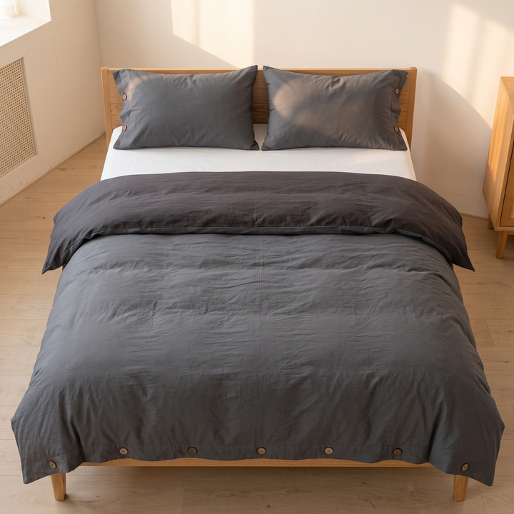 Cotton Duvet Cover Set with Buttons in Charcoal – overhead view of the whole bed with two pillows and white sheet