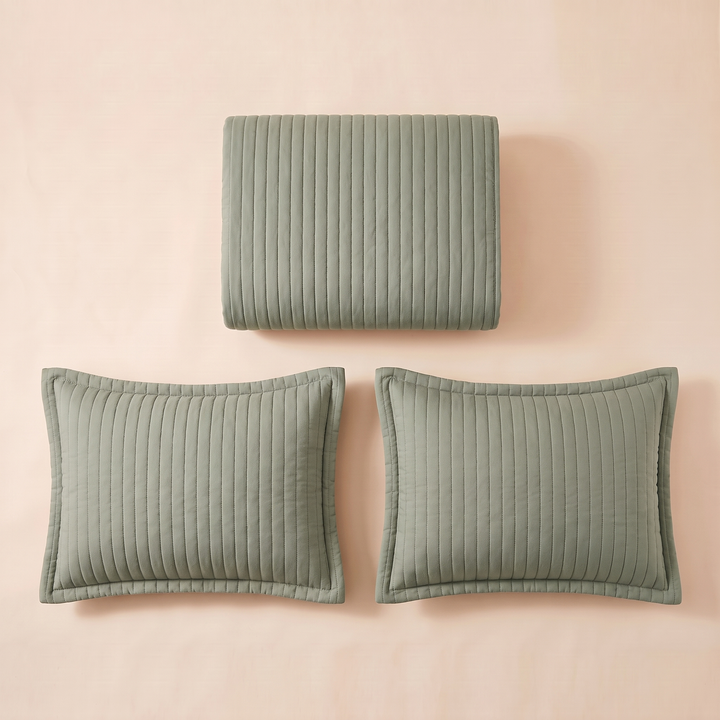Sage channel quilted bedspread folded with its 2 pillow shams