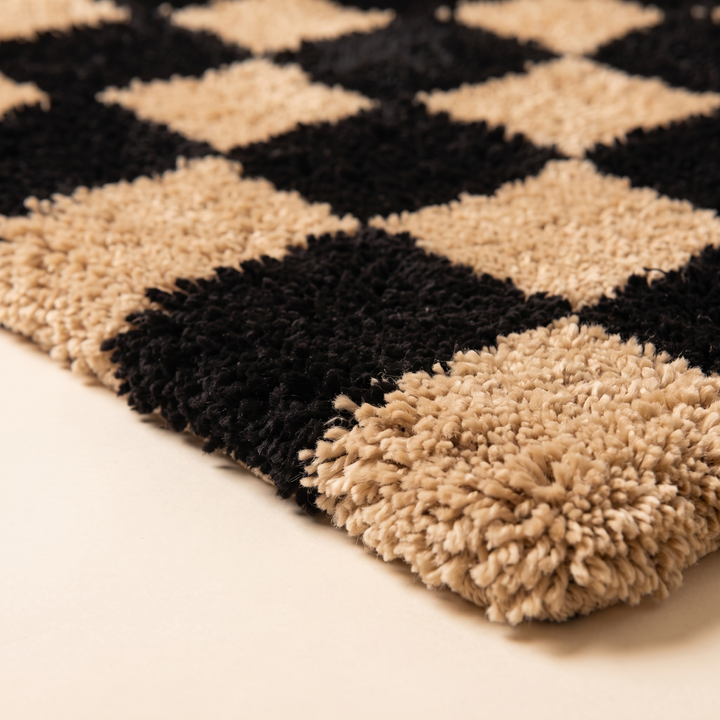 Checkered Bath Rug – Plush, Non-Slip in Black and Tan – close-up of the plush pile at the rug corner