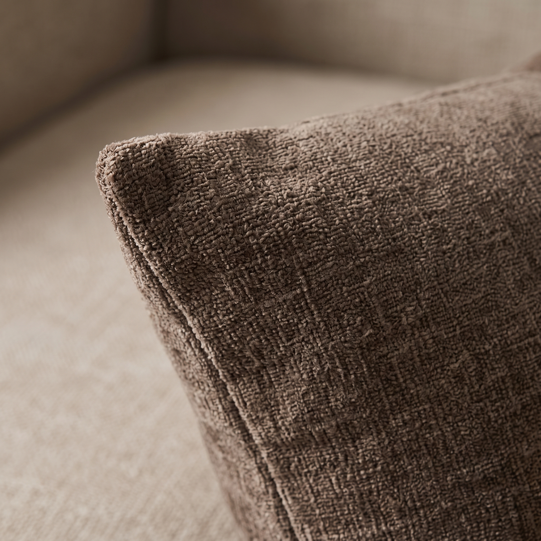 Chenille Throw Pillow Cover in Chocolate Brown – close-up of the textured weave and corner seam on a beige sofa