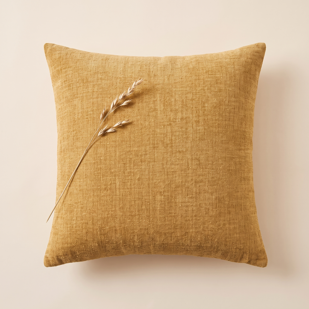Chenille Throw Pillow Cover in Mustard – overhead view with a dried grass stem laid on top