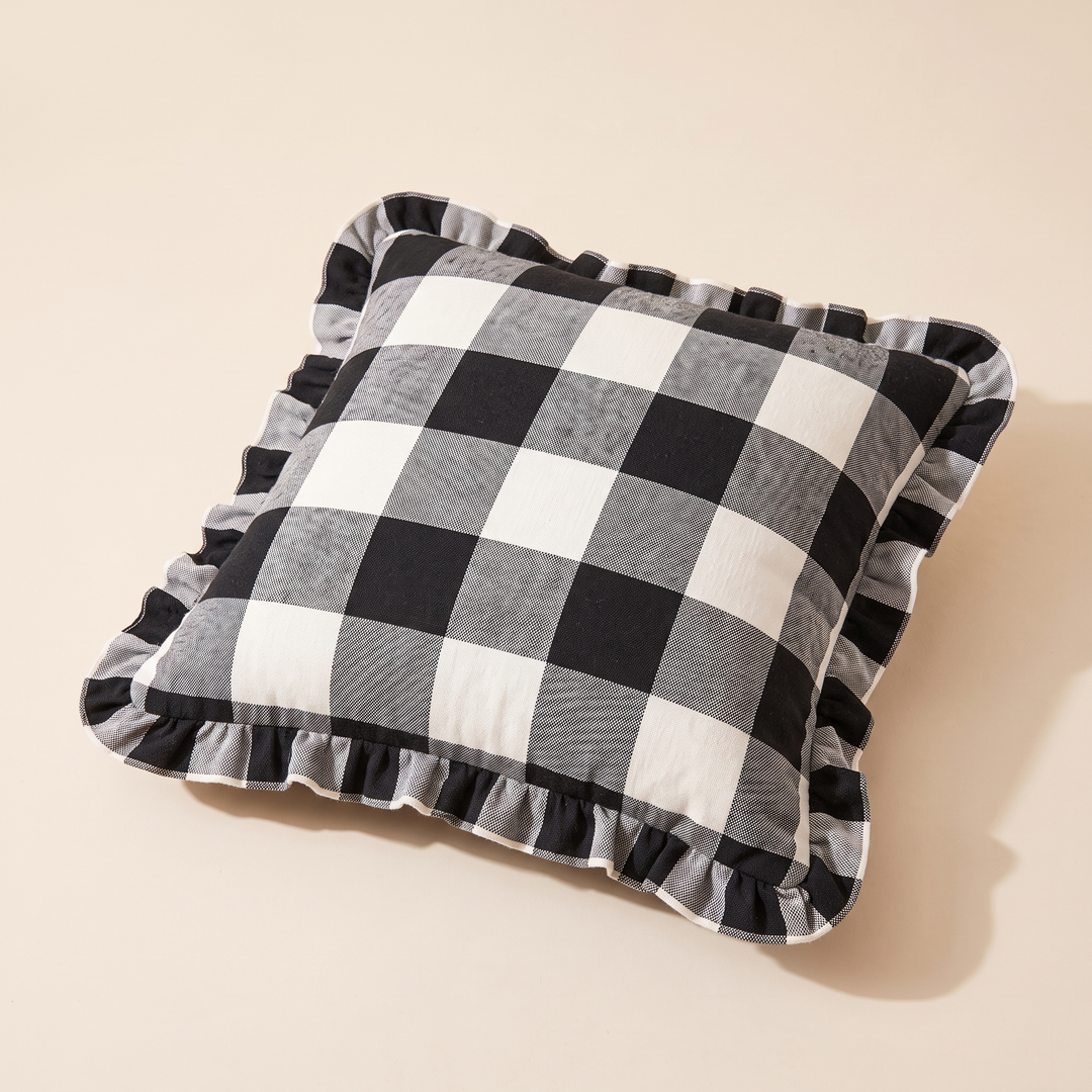 Christmas Plaid Pillow Cover in Black &amp; White – Buffalo Check – laid flat on a plain surface, angled overhead view