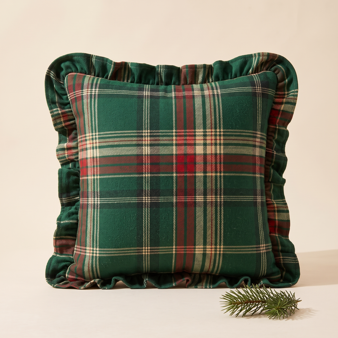 Christmas Plaid Pillow Cover in Green – Tartan – propped upright with a small pine sprig beside it