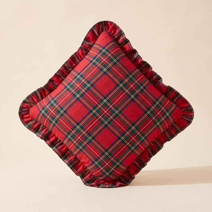 Christmas Plaid Pillow Cover in Red – Classic Tartan – balanced on one corner in a diamond orientation, casting soft shadow