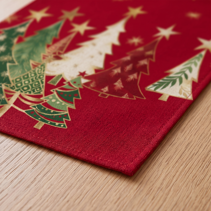 Christmas Table Runner – Tree Print in Red – Christmas Trees – close-up of one hemmed corner lying flat on a wooden surface