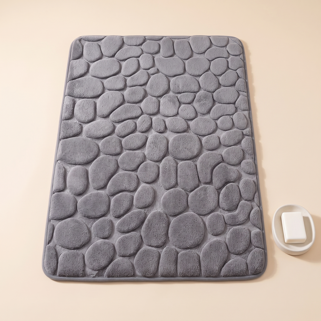 Non-Slip Memory Foam Bath Mat – Cobblestone in Gray – top-down with a soap dish and soap bar beside the right edge