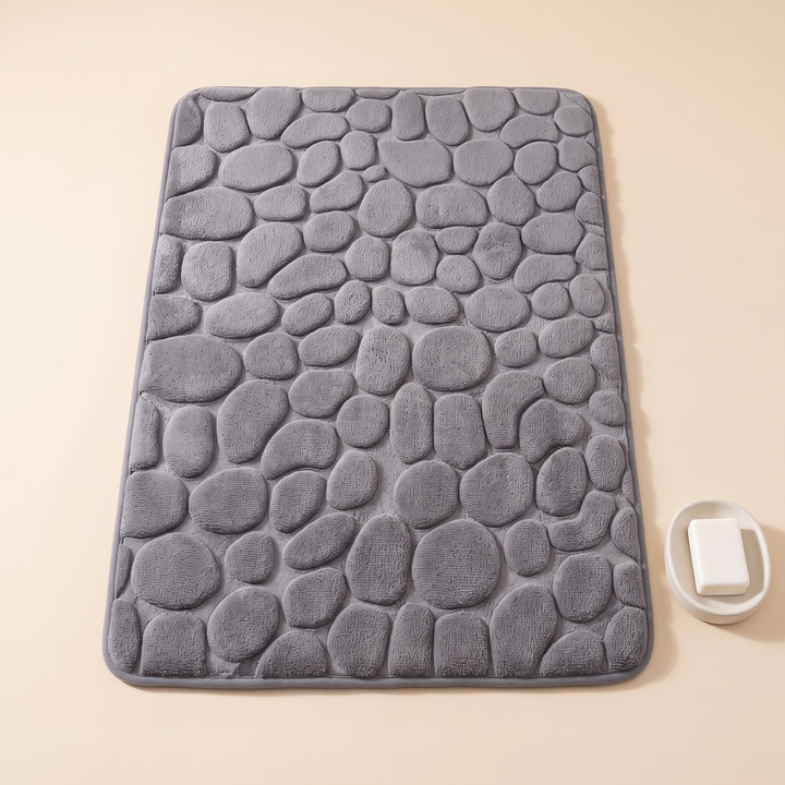Non-Slip Memory Foam Bath Mat – Cobblestone in Gray – top-down with a soap dish and soap bar beside the right edge
