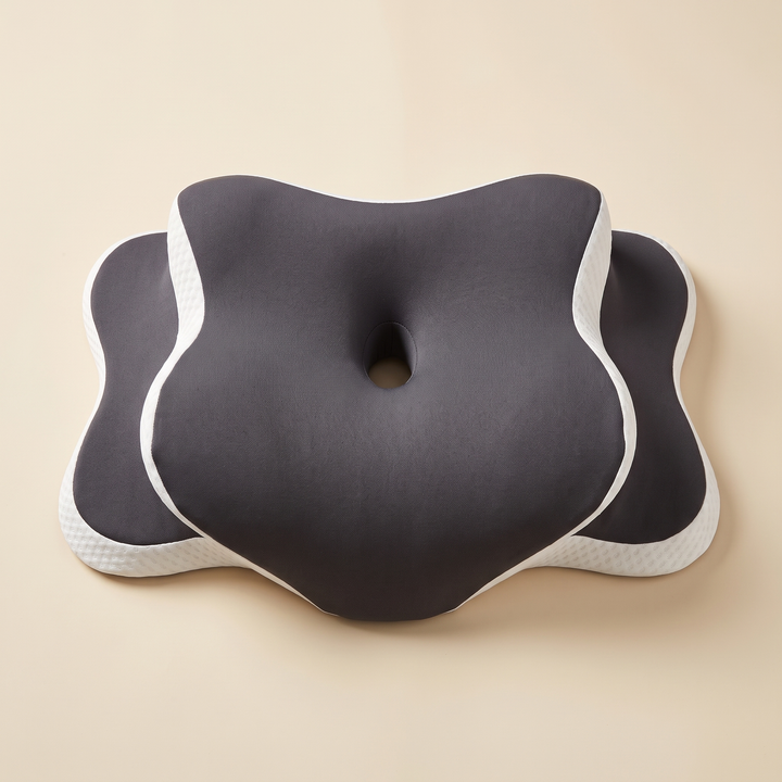 Contour Memory Foam Pillow – Butterfly Shape in Dark Gray – two stacked pillows on a plain beige background, top-down view