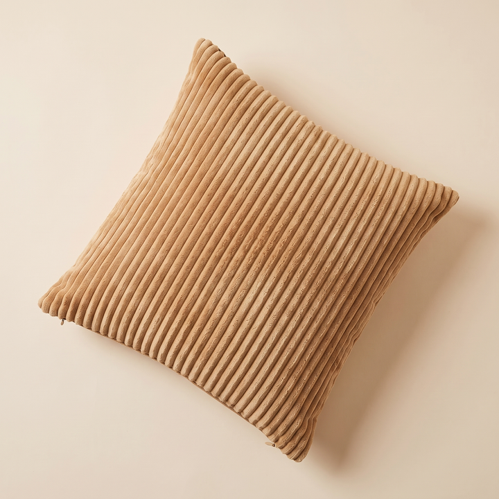 Corduroy Pillow Cover in Camel – flat lay from above, set diagonally on a plain cream surface