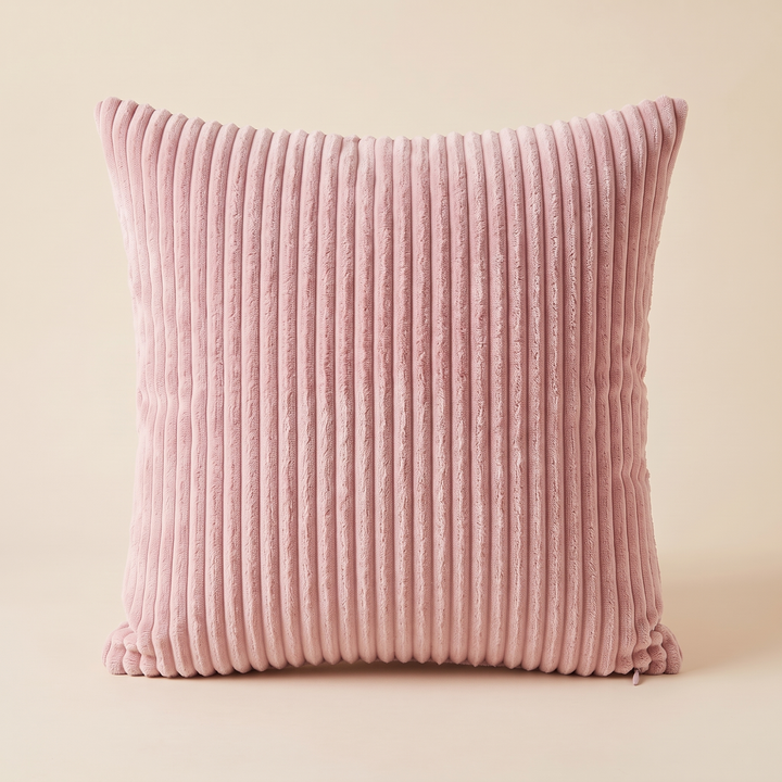 Corduroy Pillow Cover in Dusty Pink – centered on a peach backdrop with slightly dipped top edge