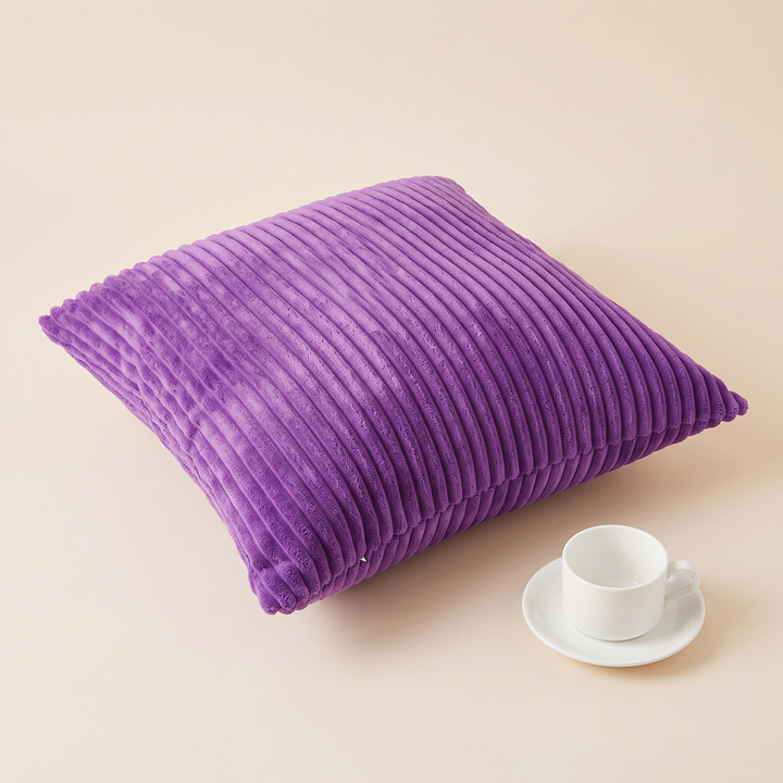 Corduroy Pillow Cover in Violet – lying flat on cream surface beside a white cup and saucer