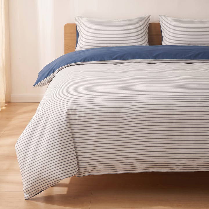 Cotton Duvet Cover Set in Gray Stripe – two pillows on bed beside sheer curtain in sunlight