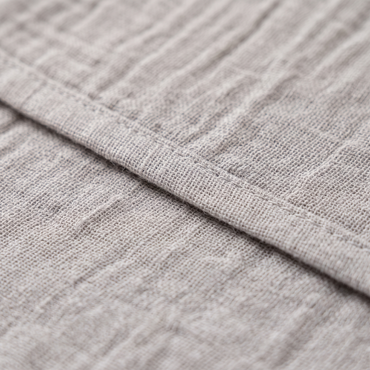 Cotton Gauze Napkins – Set of 6 in Gray – close-up of the hemmed edge and crinkled gauze texture