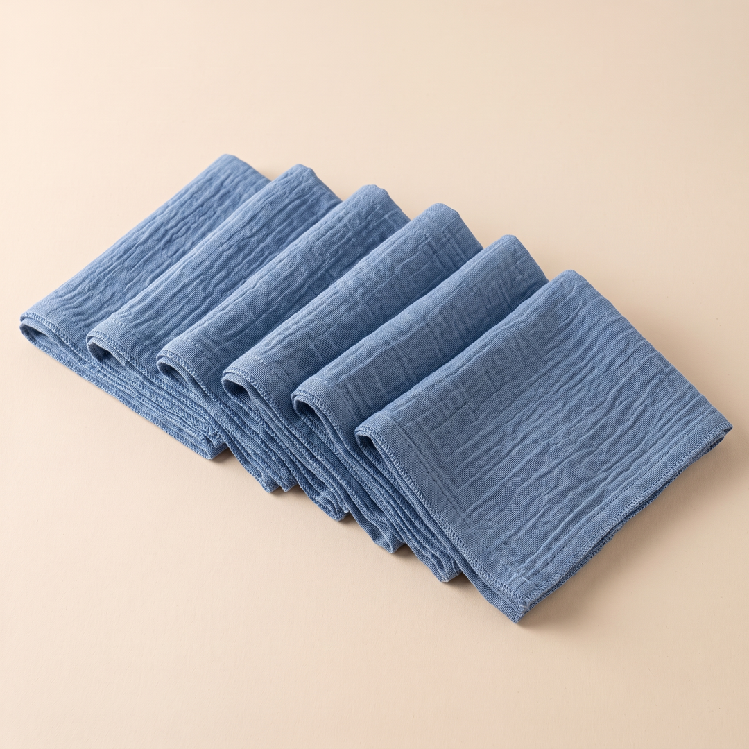 Cotton Gauze Napkins – Set of 6 in Blue – stepped row of folded corners from a raised side angle