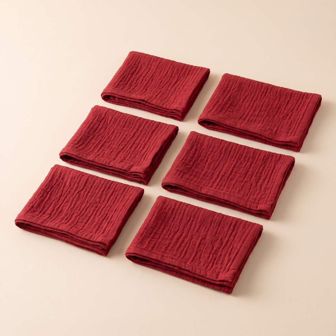Cotton Gauze Napkins – Set of 6 in Red – two tilted columns of three on a cream surface