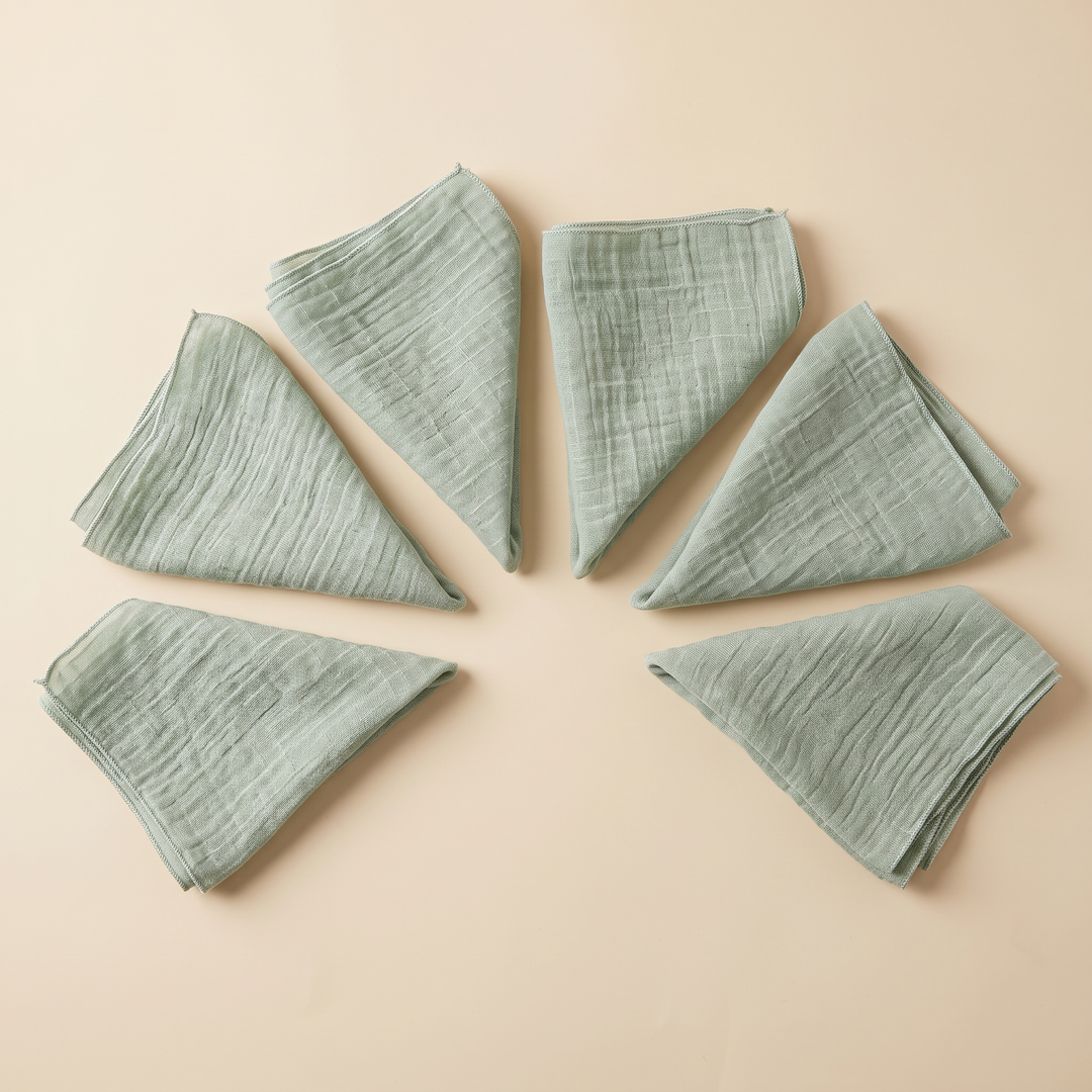 Cotton Gauze Napkins – Set of 6 in Sage – folded triangles arranged in a half-circle with points toward center