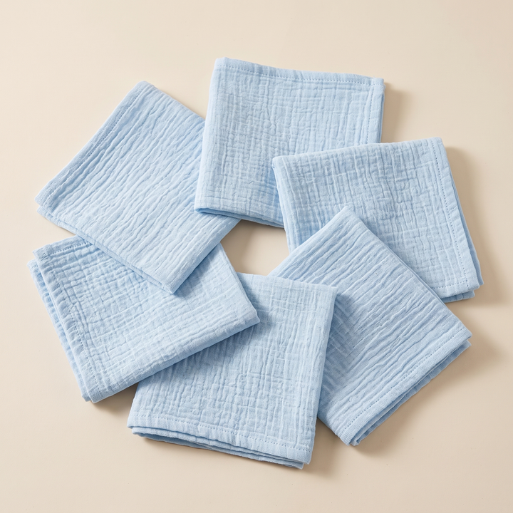 Cotton Gauze Napkins – Set of 6 in Light Blue – overlapping in a closed ring around an open center