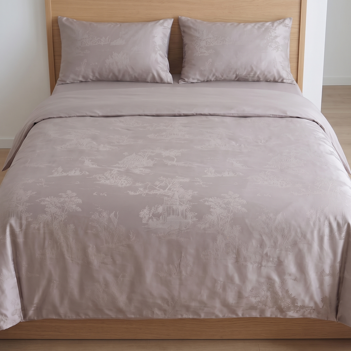 Cotton Jacquard Bedding Set in Mauve Toile – straight-on front view of two pillows and duvet against oak headboard