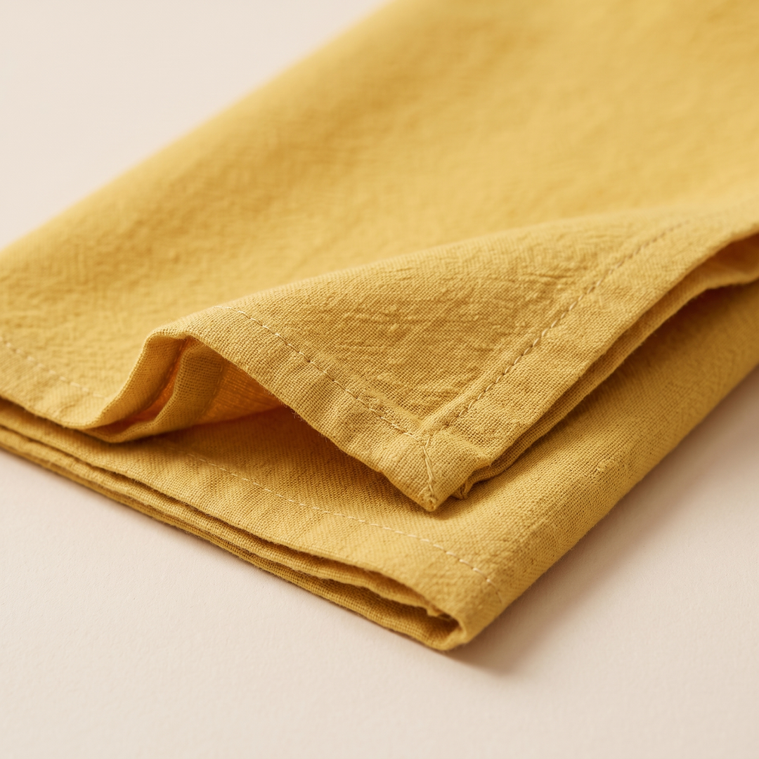 Cotton Cloth Napkins – Set of 24 in Golden Yellow – close-up of a folded corner showing the stitched hem