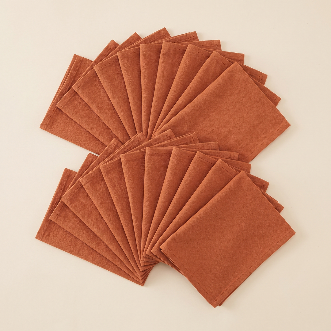 Cotton Cloth Napkins – Set of 24 in Terracotta – two rows of overlapping napkins spread out in staggered fans