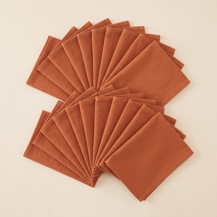 Cotton Cloth Napkins – Set of 24 in Terracotta – two rows of overlapping napkins spread out in staggered fans