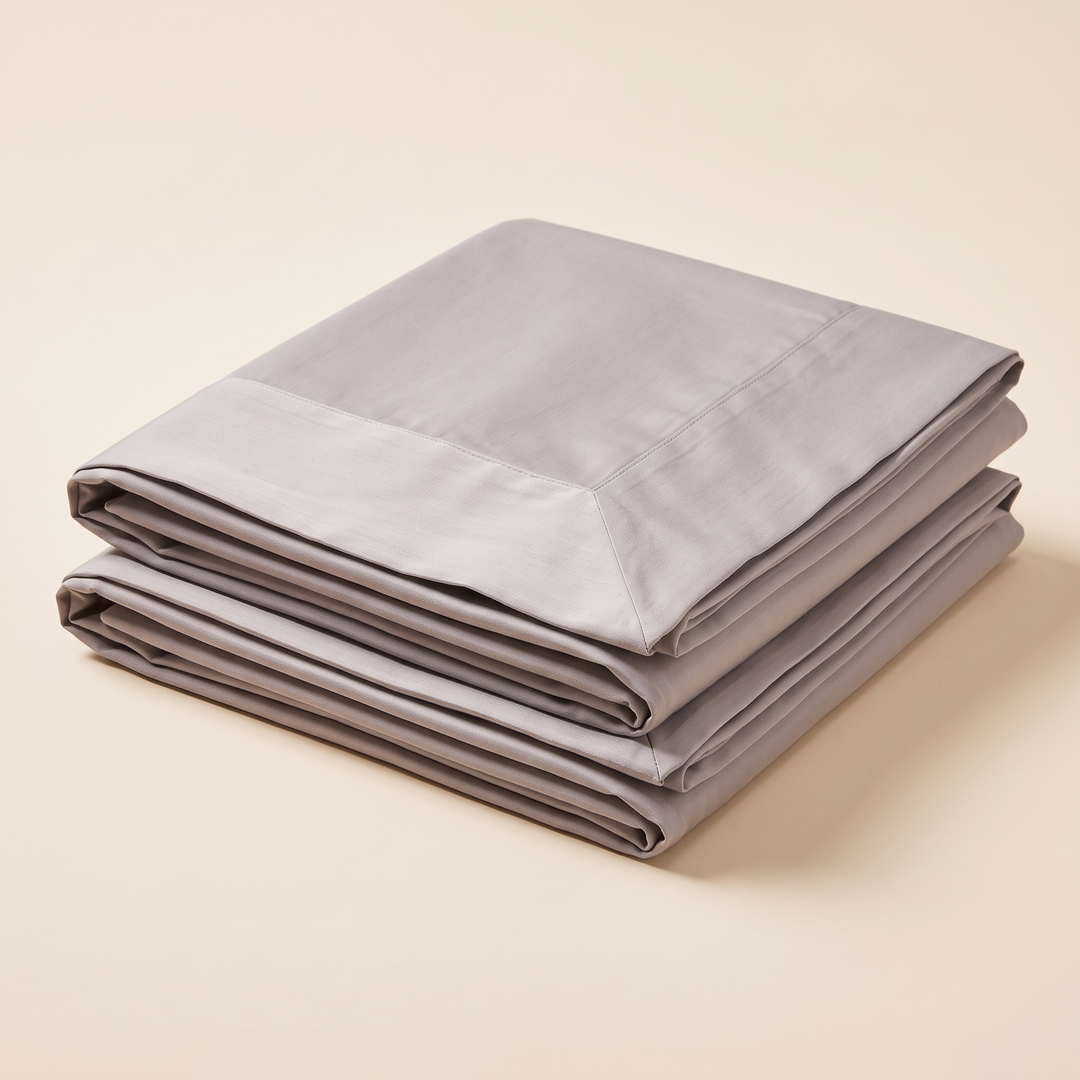 Cotton Sateen Pillowcases – Set of 2 in Taupe – high angle view of folded edges and mitered flange border