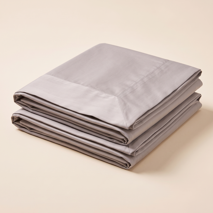 Cotton Sateen Pillowcases – Set of 2 in Taupe – high angle view of folded edges and mitered flange border
