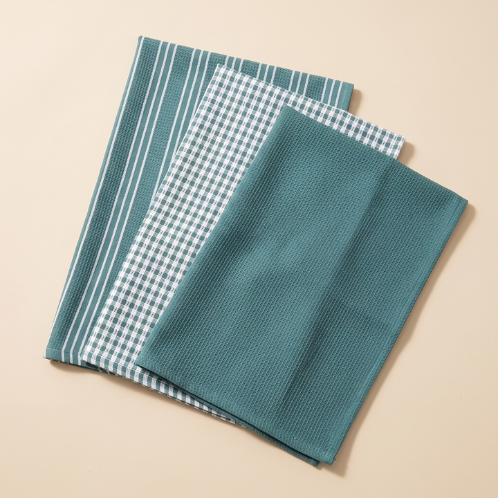 Cotton Kitchen Towels – Set of 3 in Teal – Stripe &amp; Check – three overlapping towels laid flat on a plain beige background